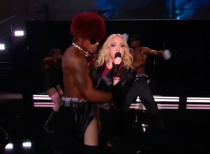 Madonna performing with backing dancer on VMAs stage Madonna performing with backing dancer on VMAs stage