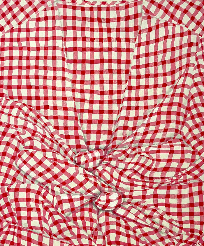 Red and white gingham pattern shirt tied at the front, forming a striking portrait of identity.