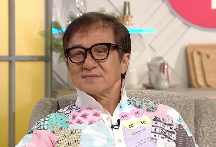 Jackie Chan, a public figure, in a colorful shirt. Many public figures destroyed their own legacies.
