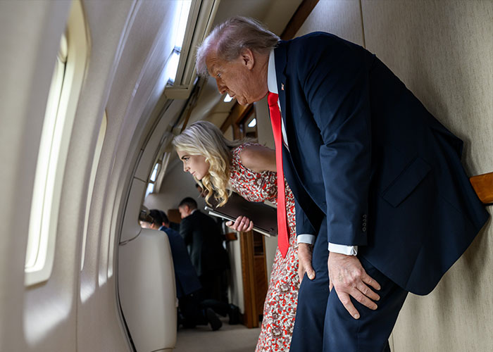 Donald Trump and Natalie Harp looking out of an airplane window, responding to viral images.