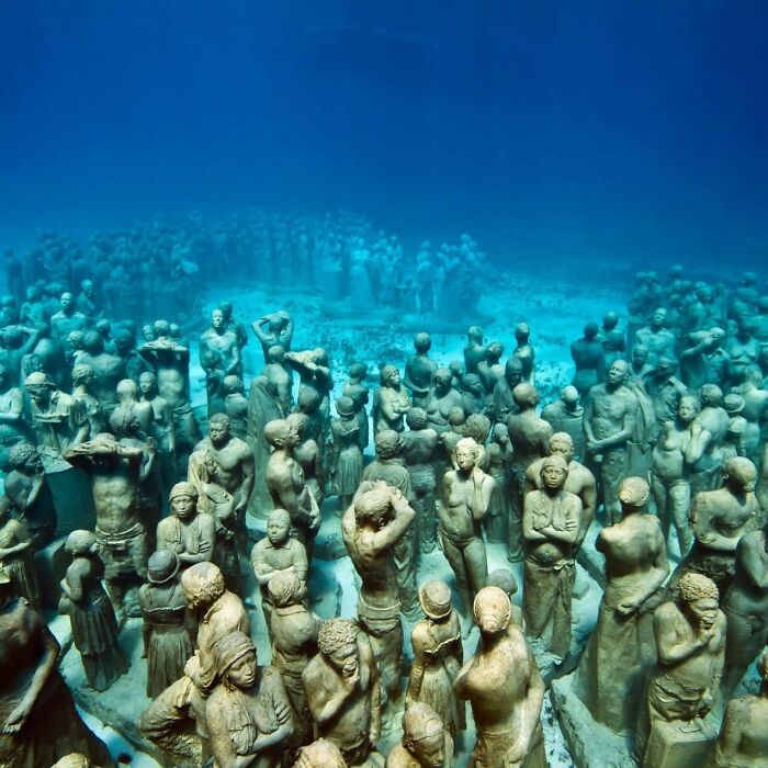 A vibrant underwater sculpture park showcasing new underwater sculptures supporting marine life.