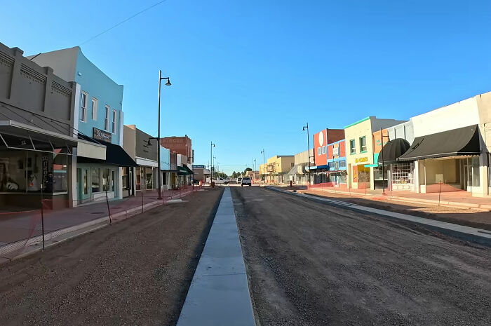 A wide shot of a street in New Mexico with various small businesses, emphasizing the unique character of the state and the name change. A wide shot of a street in New Mexico with various small businesses, emphasizing the unique character of the state and the name change.
