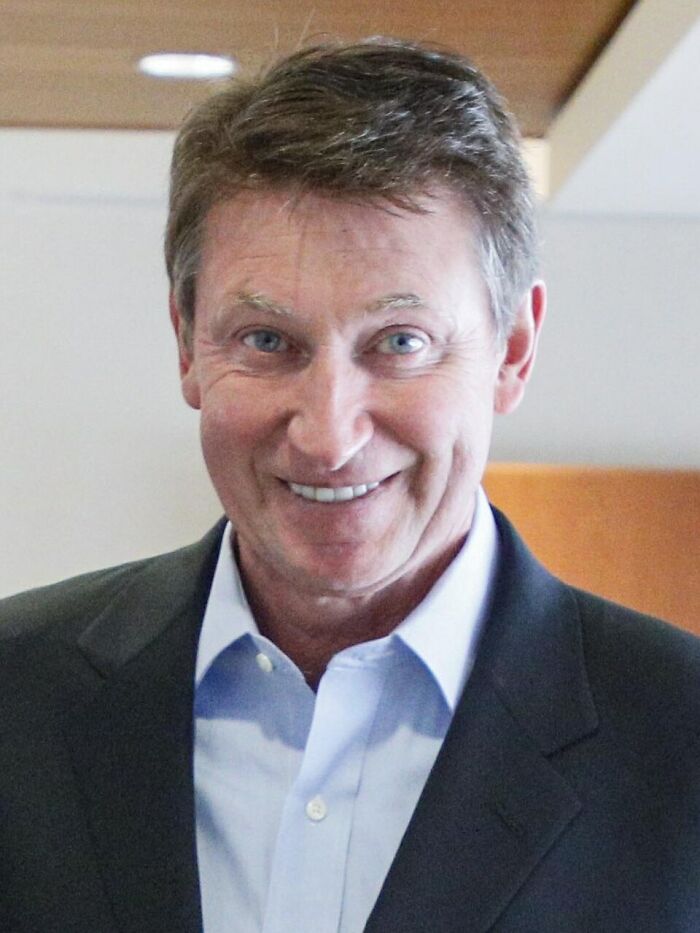 Wayne Gretzky, a public figure, smiling, whose legacy might be destroyed.