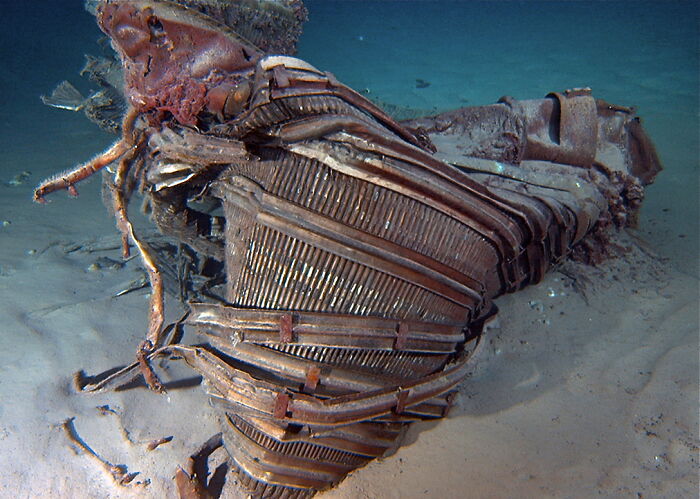 Debris of Apollo 11 rocket engine resting on the seabed, a historic find at the bottom of the ocean.