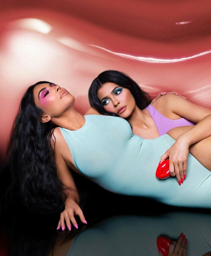 Kylie Jenner and another woman pose, illustrating a Photoshop fail with unnatural skin tones and distorted features.