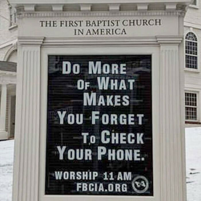 Inspirational church sign urging to do more that distracts from phone