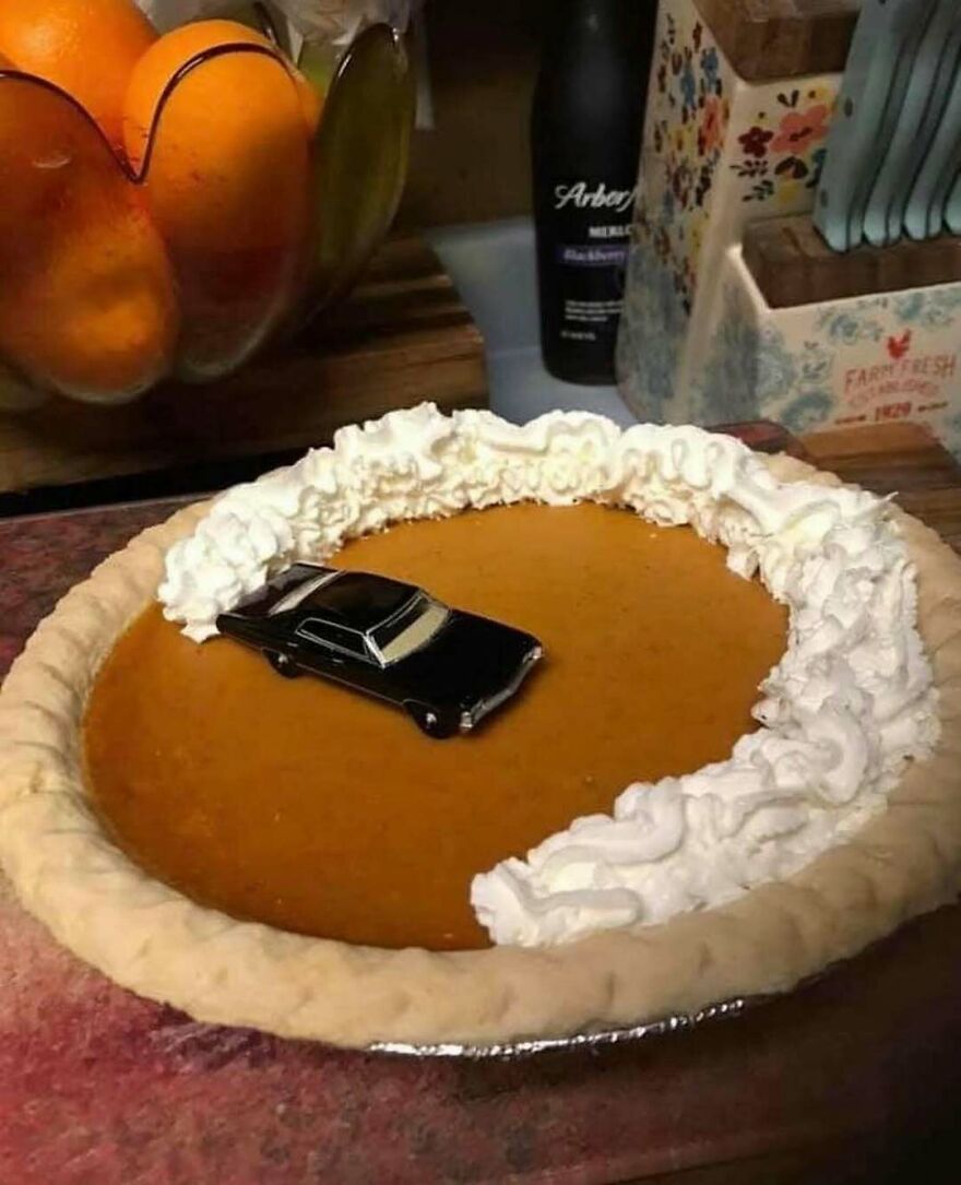 A disturbing pic of a toy car in a pumpkin pie, making you doubt your sanity.