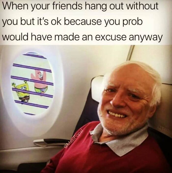 An old man smiling on a plane with Spongebob outside his window, a relatable meme for introverts