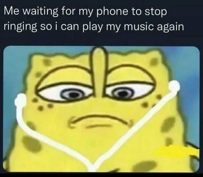 An introverts meme of SpongeBob waiting for his phone to stop ringing so he can listen to music.