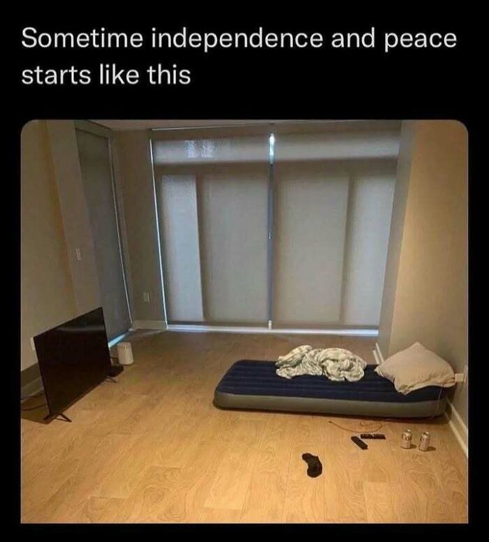 An empty room with just a TV and air mattress, fitting memes for introverts enjoying peace.