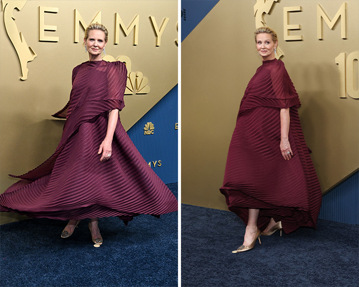 Woman at the 2026 Emmys, posing in a flowing, pleated burgundy gown, considered one of the worst dressed stars.