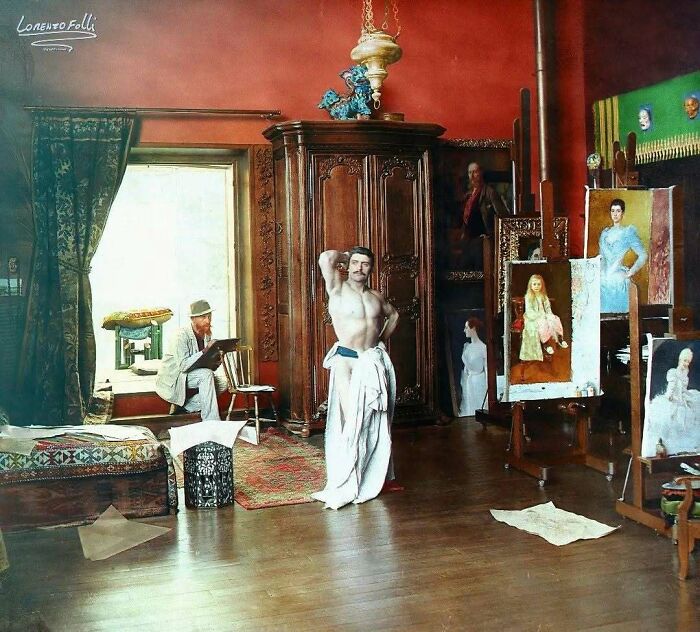 Historical colorized photos: Artist painting a male model in an art studio, surrounded by finished portraits.