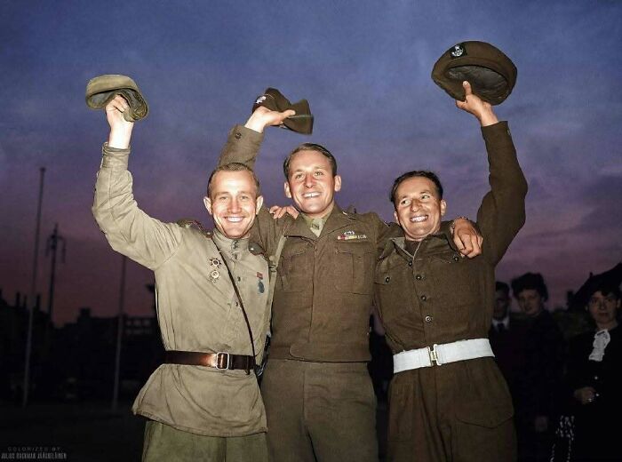 Historical colorized photos: Three soldiers in different uniforms celebrating, hats raised in the air.