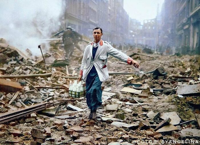 A historical colorized photo of a milkman walking through rubble after a bombing, depicting past days realistically.