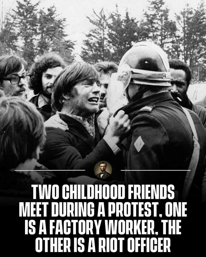 A black and white photo from history depicting two childhood friends meeting during a protest in a tense standoff