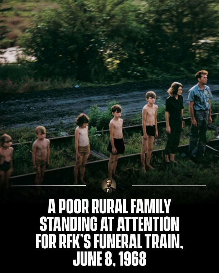 Rural family standing for RFK funeral train in 1968. Captivating photos from history.
