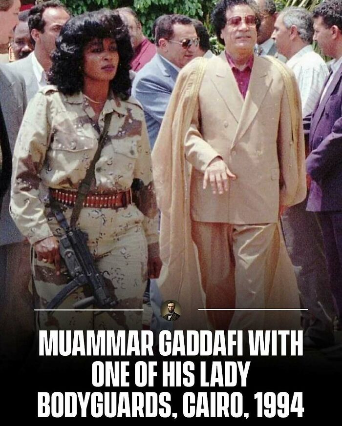 Muammar Gaddafi walking with a lady bodyguard in Cairo, 1994, capturing interesting photos from history.