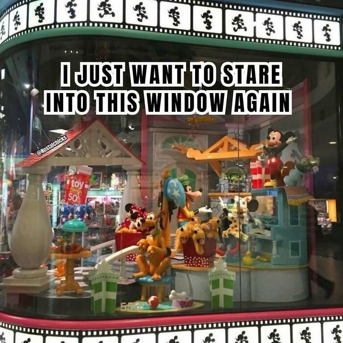 Vintage Disney Store window display full of classic toys, evoking 90s nostalgic pics.