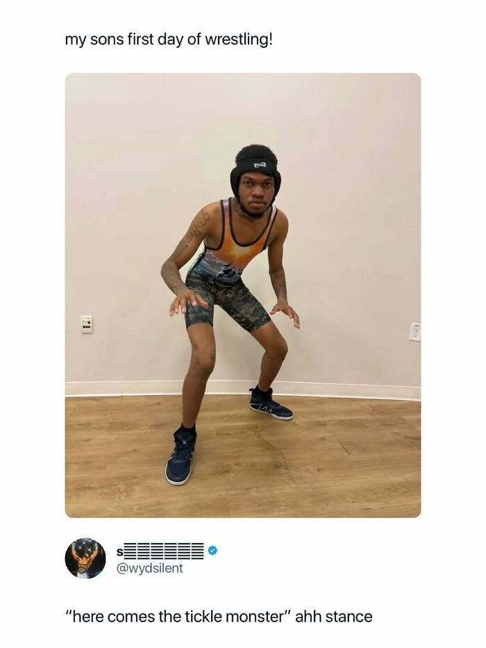 A person in a wrestling singlet and headgear, posing for a photo. A hilarious meme.