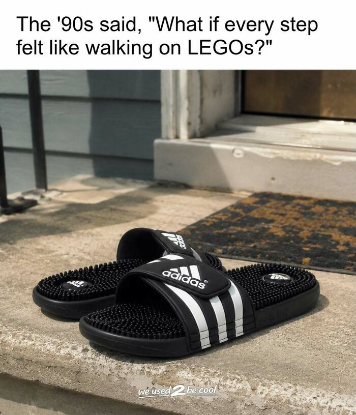 Classic black and white Adidas massage slides, bringing back nostalgic 90s pics vibes.