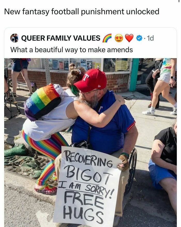 A person with rainbow leggings hugs a man in a wheelchair holding a Free Hugs sign. Hilarious memes.