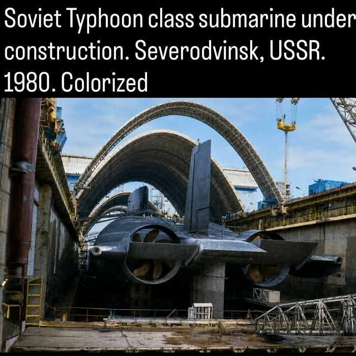 A massive Soviet Typhoon-class submarine under construction in dry dock.