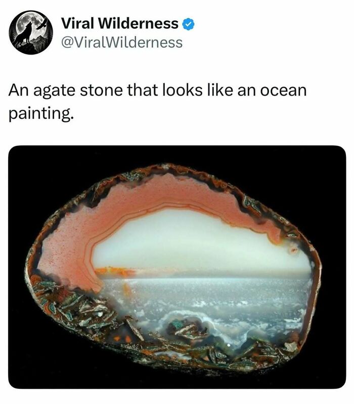 Agate stone resembling a detailed ocean painting with waves and sky