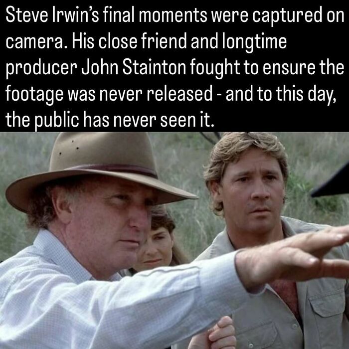 A historical photo of Steve Irwin alongside John Stainton pointing towards the distance during filming.