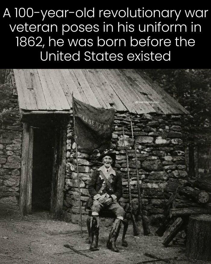 A 100-year-old revolutionary war veteran posing in uniform, showing photos from history