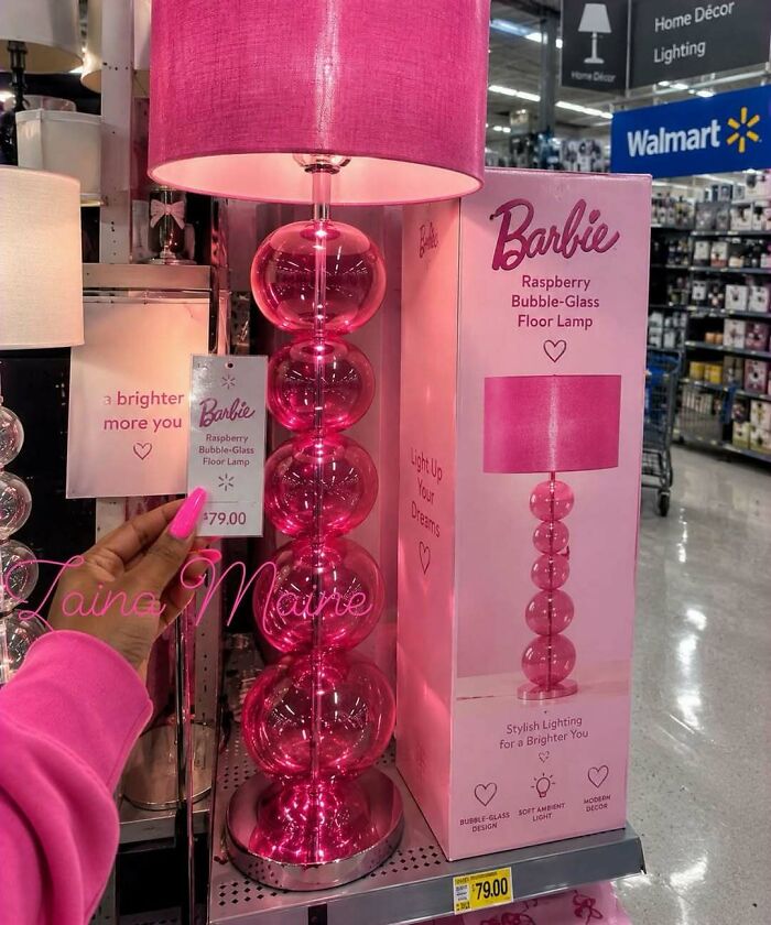 A bright pink Barbie bubble-glass floor lamp in a store, recalling 90s nostalgic pics of home decor.