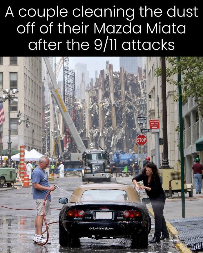 A couple washing dust off their Mazda Miata near ground zero, presenting photos from history