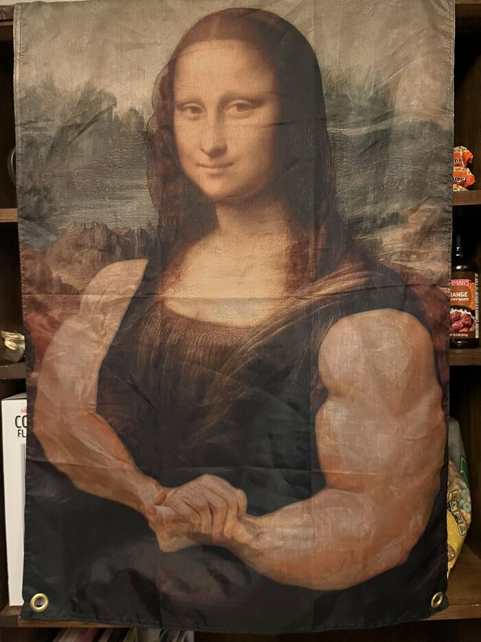 A flag depicting the Mona Lisa with muscular arms, an unhinged image.