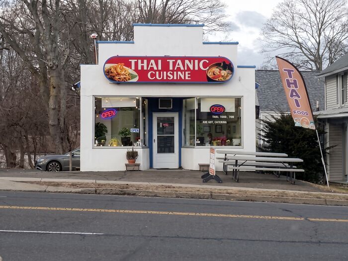 Restaurant storefront named Thai Tanic Cuisine creating a funny Titanic pun