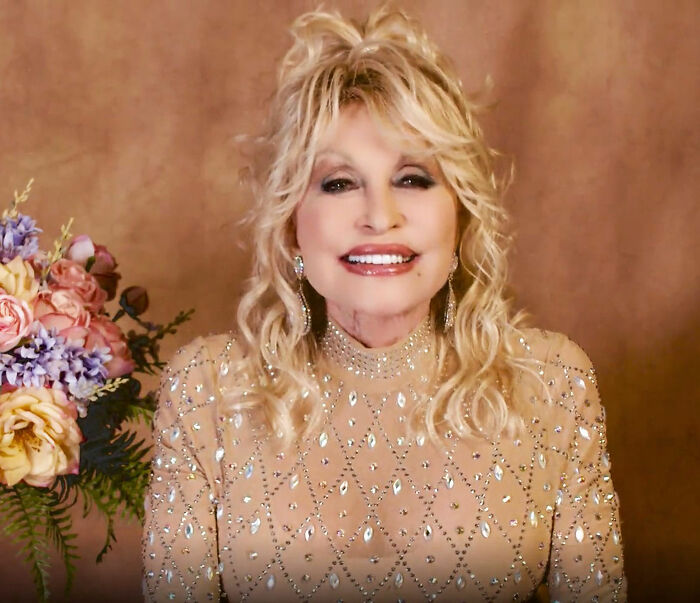 Dolly Parton in a stunning bedazzled gown, smiling, from a video turning heads online. Dolly Parton in a stunning bedazzled gown, smiling, from a video turning heads online.