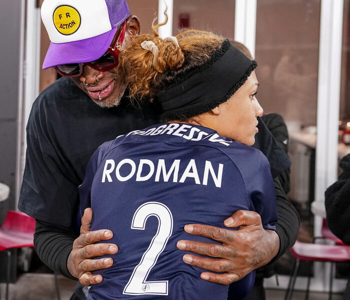Dennis Rodman embracing his daughter, the woman dancing at US Open, who became a viral sensation