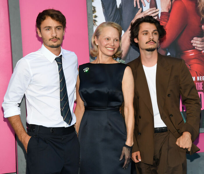 Pamela Anderson with her sons, representing her strength after her harrowing health battle. Pamela Anderson with her sons, representing her strength after her harrowing health battle.