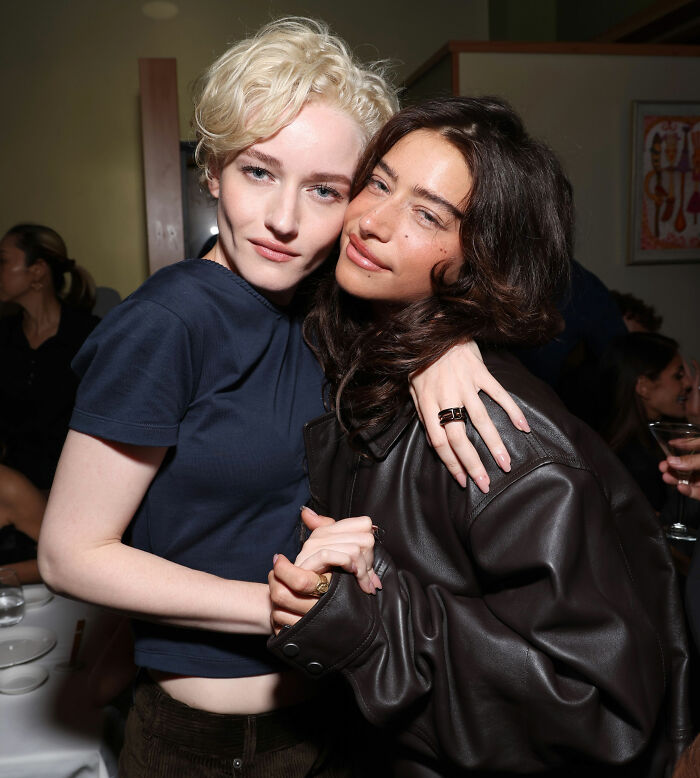 Hollywood star and another woman embrace, possibly related to the awkward interaction scrutiny.