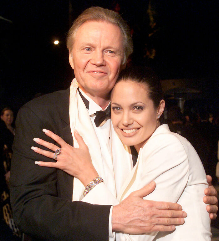 Angelina Jolie hugging her father Jon Voight, reflecting her daughter Zahara's family dynamics.