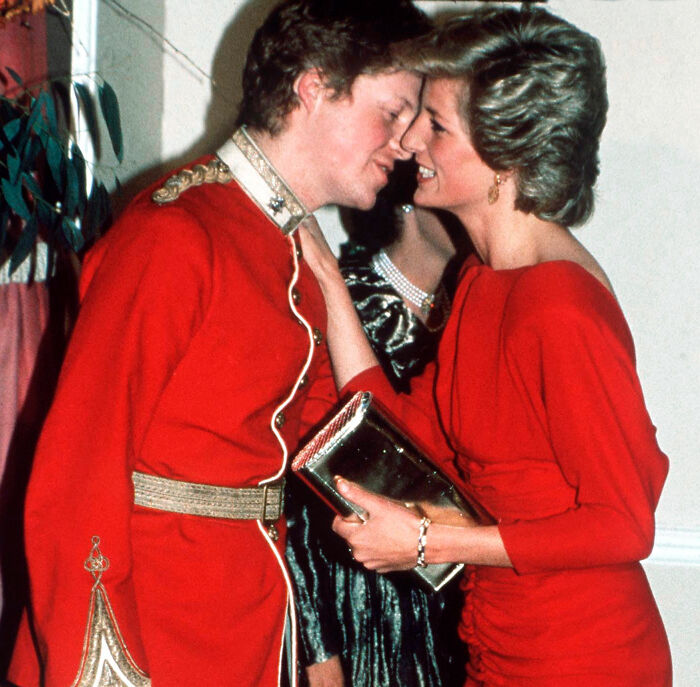 Prince Harry and Princess Diana interacting at an event, relevant to Prince George's Eton College portrait discussion. Prince Harry and Princess Diana interacting at an event, relevant to Prince George's Eton College portrait discussion.