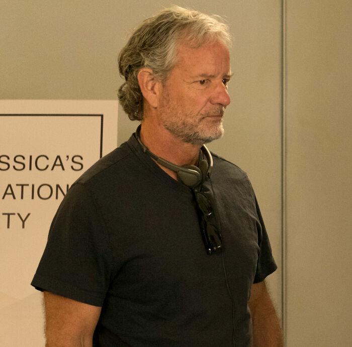Close-up of a major figure from the Modern Family reunion pic, looking pensive.
