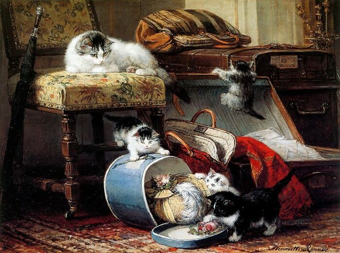 A vibrant 19th-century cat painting depicting a playful scene of kittens exploring luggage, with an adult cat observing.