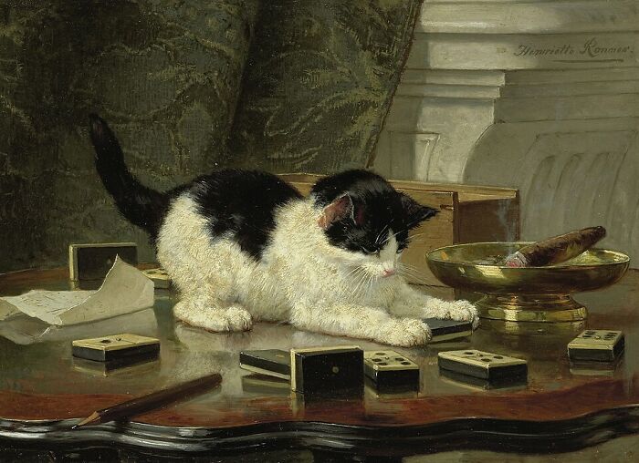 A 19th-century cat painting shows a playful black and white cat batting at dominoes on a table. A cat painting capturing feline curiosity.