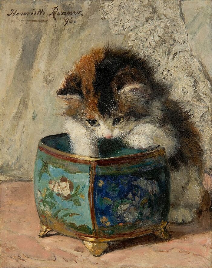 Artist's cat paintings: A curious calico kitten peeks into a decorative blue pot in a charming 19th-century painting.