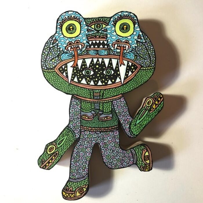Theo Ellsworth figurine of a monster with large eyes and sharp teeth