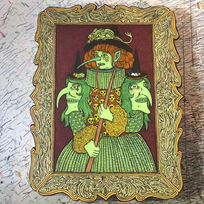 Theo Ellsworth art with green three-faced figure in ornate frame