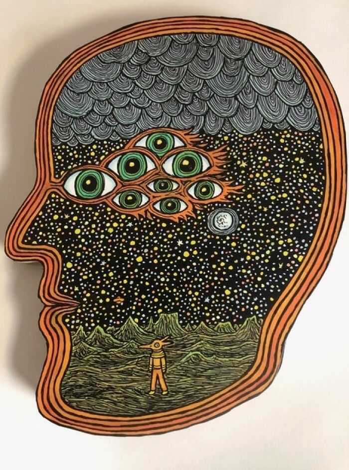 Theo Ellsworth surreal drawing of a head filled with stars, green eyes, and a small figure in a landscape