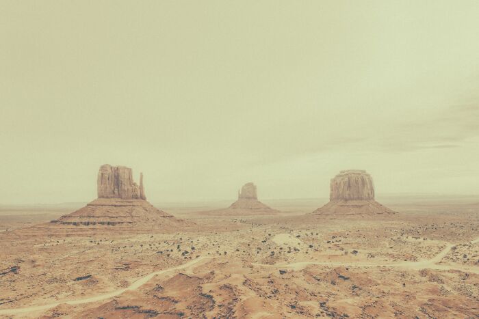 Iconic Monument Valley landscape showcasing the dusty remnants of the American West.
