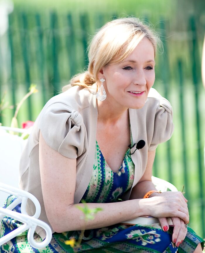 J.K. Rowling, a public figure, is sitting outdoors, her legacy possibly destroyed.