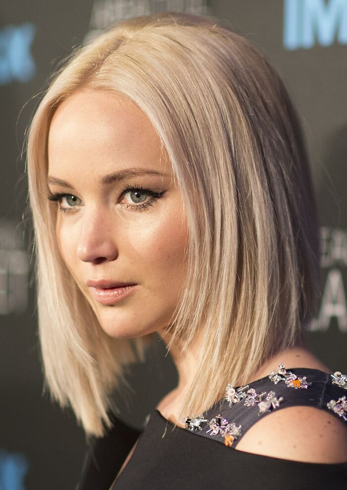 Jennifer Lawrence with a blonde bob, looking to the side, suitable for discussions on celebrity hot takes.