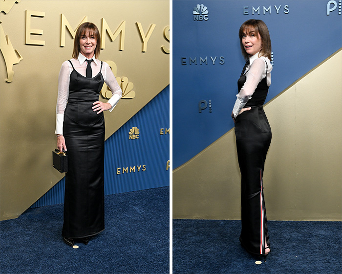 A star in a worst dressed outfit at the 2026 Emmys, wearing a black slip dress over a white collared shirt and black tie.